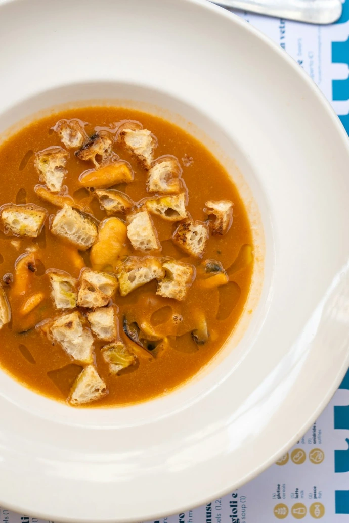 A bowl of soup is sitting on a table